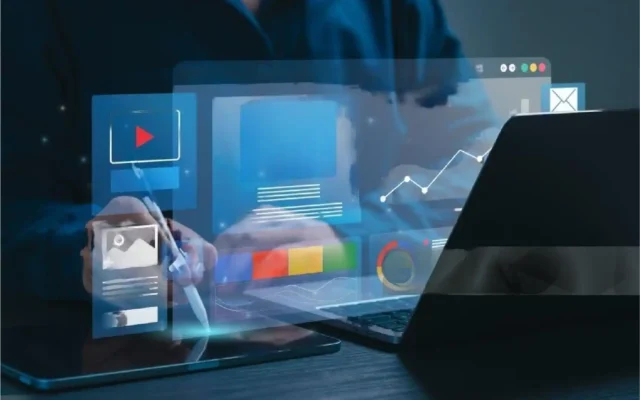Digital marketing professional working with multiple data analytics tools on laptop and tablet.
